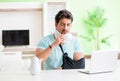 Young student man with neck and hand injury at home Royalty Free Stock Photo