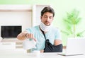 Young student man with neck and hand injury at home Royalty Free Stock Photo