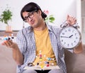 Young student physicist preparing for exam at home