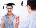 Young student planning graduation speech in front of mirror