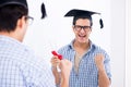 The young student planning graduation speech in front of mirror