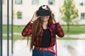 Young student plays with virtual reality glasses