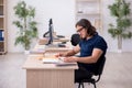 Young male student preparing for exams in the classroom Royalty Free Stock Photo