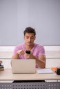 Young male student preparing for exams in the classroom Royalty Free Stock Photo