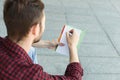 Young student making note, over shoulder shot Royalty Free Stock Photo