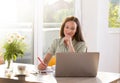 Young woman studying reading working from home using computer Royalty Free Stock Photo