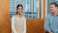 Young student smiling while listening other student in meeting. Edification.