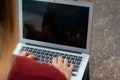 Young student using laptop outdoors Royalty Free Stock Photo