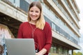 Young student using laptop outdoors Royalty Free Stock Photo