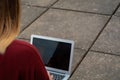 Young student using laptop outdoors Royalty Free Stock Photo