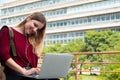 Young student using laptop outdoors Royalty Free Stock Photo