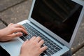 Young student using laptop outdoors Royalty Free Stock Photo