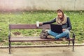 Young student Using laptop in park Royalty Free Stock Photo