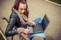 Young student Using laptop in park Royalty Free Stock Photo
