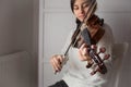 Young student violinist practice at home