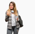 Young student woman with headphones and backpack Royalty Free Stock Photo