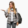 Young student woman with headphones and backpack Royalty Free Stock Photo