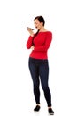 Young student woman yelling to the mobile phone Royalty Free Stock Photo
