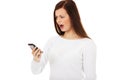 Young student woman yelling to the mobile phone Royalty Free Stock Photo