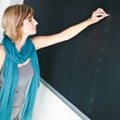 Young student writing on the blackboard Royalty Free Stock Photo