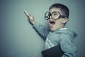 Young student writing on a blackboard school with a book in hand Royalty Free Stock Photo