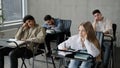 Young students employees workers unmotivated staff sitting in classroom listening boring lecture tedious coach teacher Royalty Free Stock Photo