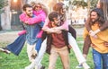 Young students friends having fun outdoor - Happy people after university laughing together - Youth, multiracial and friendship Royalty Free Stock Photo