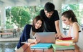 Young Students Group Consult with School Folders,Laptop Computer