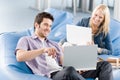 Young students at high-school pointing at laptop