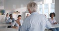 Young students listening to professor in classroom at college Royalty Free Stock Photo