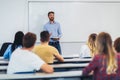 Students listening to professor in the classroom on college Royalty Free Stock Photo