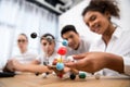 young students picking molecular model