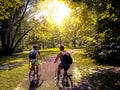 Young students riding their bikes on a park Royalty Free Stock Photo