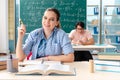 The young students taking the math exam in classroom