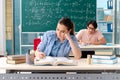 The young students taking the math exam in classroom