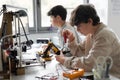 Young students using a 3D printer in the lab Royalty Free Stock Photo
