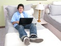 Young studying on the bed with laptop