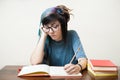 Young studying female student with books Royalty Free Stock Photo