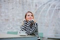 Girl with cup of coffee in autumn season garden Royalty Free Stock Photo