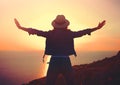 Young stylish carefree woman enjoying sunset at sea Royalty Free Stock Photo