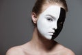 Young stylish girl with creative white and black bodyart on face looking at camera, Royalty Free Stock Photo