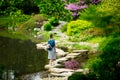 Young stylish girl have a rest near a pond Royalty Free Stock Photo