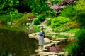 Young stylish girl have a rest near a pond Royalty Free Stock Photo