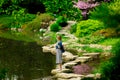 Young stylish girl have a rest near a pond Royalty Free Stock Photo