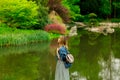 Young stylish girl have a rest near a pond Royalty Free Stock Photo
