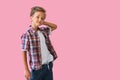 Young stylish handsome kid smiling in a white T-shirt