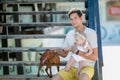 Young stylish hipster couple in love walking playing dog in tropical beach, white sand, cool outfit, romantic mood Royalty Free Stock Photo