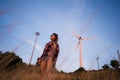 Young stylish hipster girl enjoy sunset on viewpoint. Travel woman with backpack Royalty Free Stock Photo