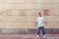 Young stylish man background wall, guy dancer, summer city, dancing break dance, healthy fitness athlete life style Royalty Free Stock Photo