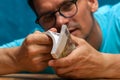 Young stylish man counting heaps of money Royalty Free Stock Photo